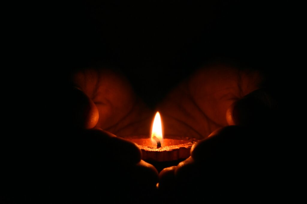 Photo by Dhivakaran S: https://www.pexels.com/photo/tealight-candle-on-human-palms-783200/